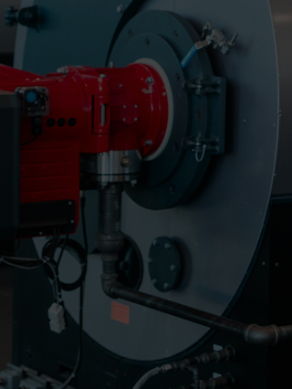 Close-up of a red mechanical component on a dark background