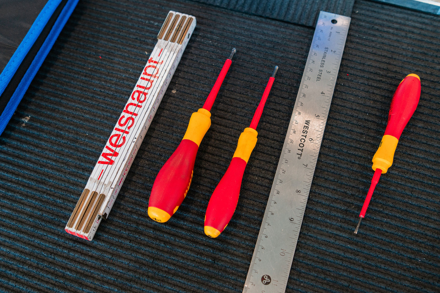 Two red and yellow screwdrivers