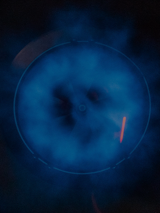 Abstract blue and black circular design with a central focus